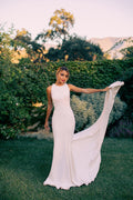 Elegant and modern, this satin wedding gown