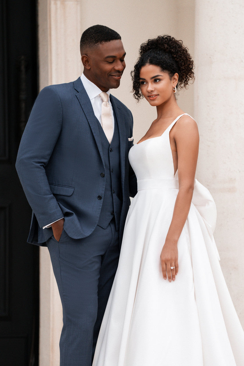 Mikado ballgown stuns with a classic scoop neckline and delicate spaghetti straps