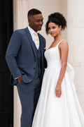Mikado ballgown stuns with a classic scoop neckline and delicate spaghetti straps