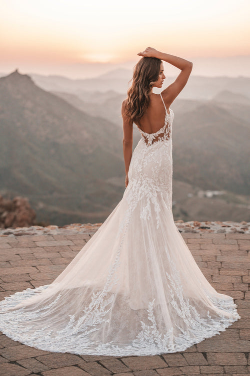 Chantilly lace and translucent tulle provides beautiful contrast to the sequined and tonal beading