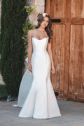 Strapless stretch Mikado gown is beautifully clean in silhouette and accented with an oversized Bow