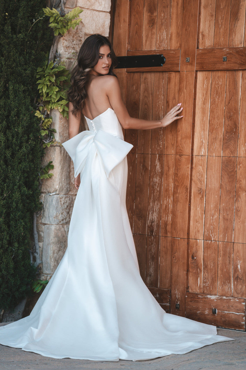 Strapless stretch Mikado gown is beautifully clean in silhouette and accented with an oversized Bow