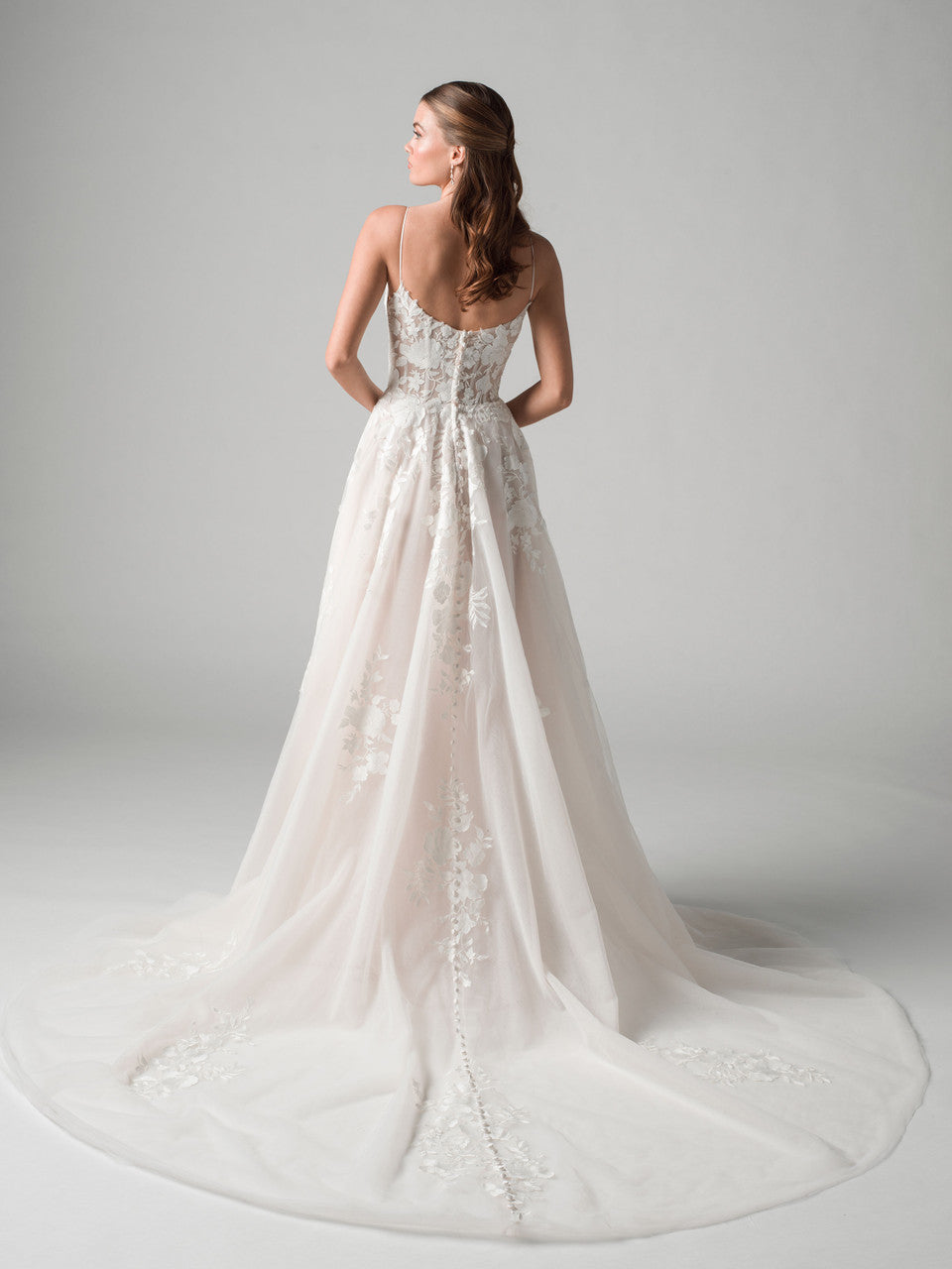 A-line wedding gown blends timeless elegance with modern detail.