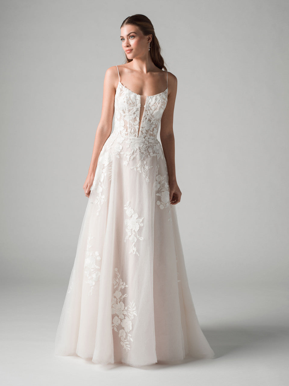 A-line wedding gown blends timeless elegance with modern detail.